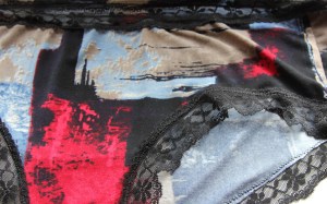 Showing a bit of a lacy leg